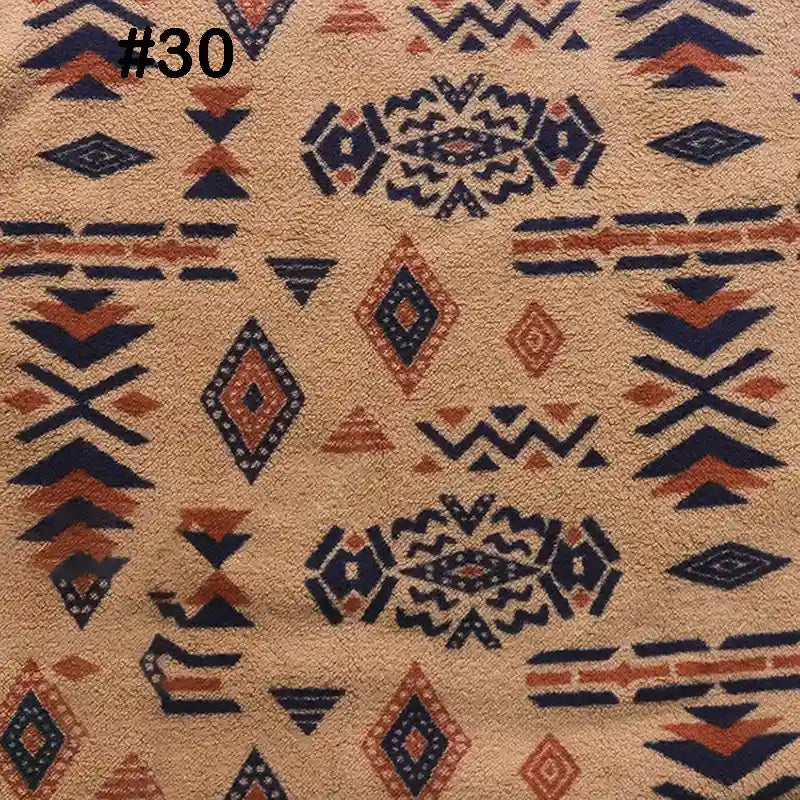 The Longon Craft Printed Polar Fleece Fabric By The Yard features a polyester ethnic leopard pattern with geometric and diamond motifs in navy, rust, and black on tan, arranged in horizontal rows. Perfect for DIY craft sewing projects.