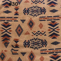 The Longon Craft Printed Polar Fleece Fabric By The Yard features a polyester ethnic leopard pattern with geometric and diamond motifs in navy, rust, and black on tan, arranged in horizontal rows. Perfect for DIY craft sewing projects.