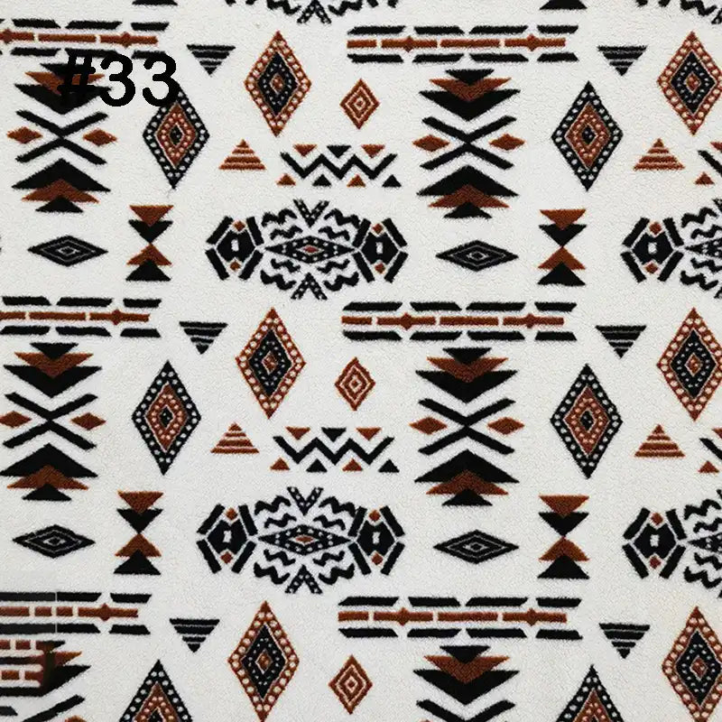 Longon Craft's Printed Polar Fleece Fabric By The Yard features an ethnic leopard pattern in black, brown, and orange on a white background, perfect for DIY crafts, sewing projects, and blankets. "#33" appears in the top left corner.