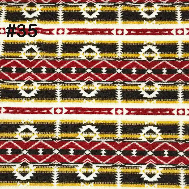 Longon Craft’s Printed Polar Fleece Fabric By The Yard features an ethnic leopard-inspired pattern in yellow, black, red, and white, with geometric diamond and zigzag shapes—perfect for DIY craft and sewing projects.