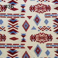 Longon Craft’s Printed Polar Fleece Fabric by the Yard features an ethnic leopard pattern in red and blue on cream. Ideal for DIY crafts and blankets. #36 is in the top left corner—quality polyester fleece material for sewing projects.