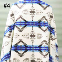 Longon Craft Printed Polar Fleece Fabric by the yard features an ethnic leopard pattern in brown, black, and blue on white polyester—ideal for DIY crafts and sewing projects.