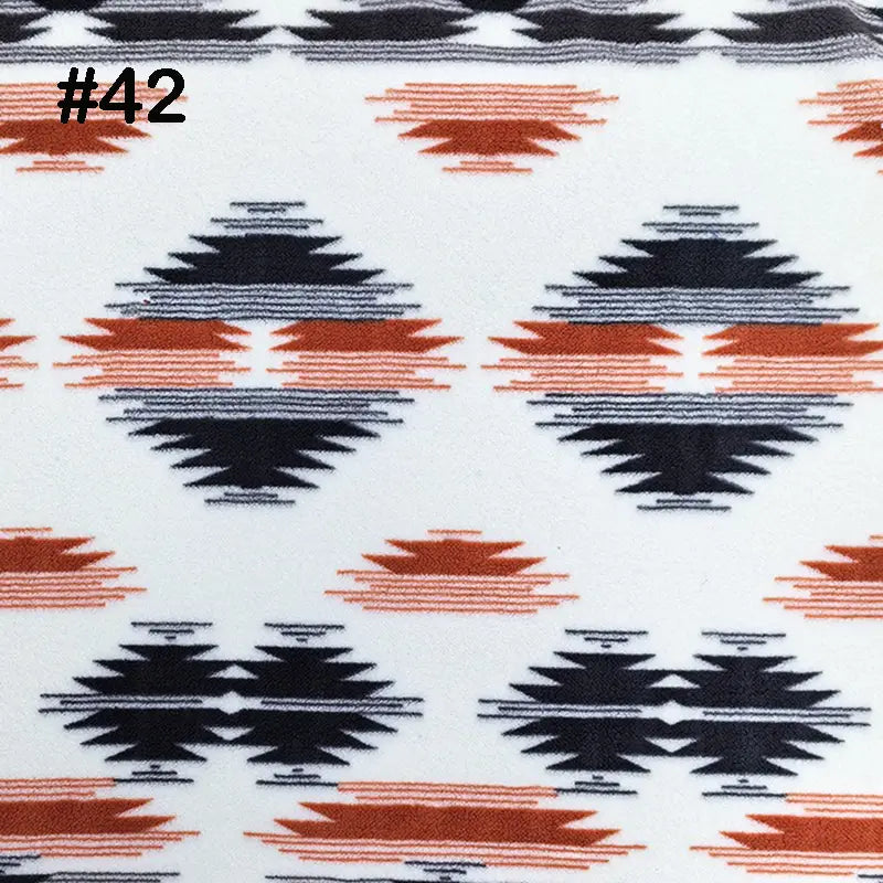 Longon Craft Printed Polar Fleece Fabric By The Yard features an ethnic leopard pattern in black and rust-orange on white, ideal for DIY crafts and sewing. #42 is noted in black at the top left, showcasing a tribal-inspired style. Polyester material.