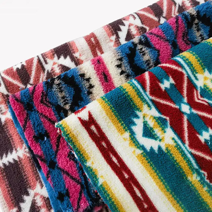 Three vibrant Longon Craft polar fleece fabrics, featuring ethnic leopard patterns in red, blue, pink, yellow, white, and black polyester, are stacked together on a white background. Perfect for DIY crafts or sewing projects.