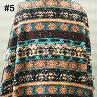 Longon Craft's Printed Polar Fleece Fabric by the yard features an ethnic leopard pattern in teal, brown, cream, and black. Perfect for DIY crafting or sewing blankets, this polyester fleece is ideal for creative projects.