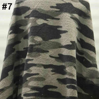 A close-up of Longon Craft's Printed Polar Fleece Fabric By The Yard, featuring a polyester ethnic leopard pattern. The top left corner displays a black number 7. Ideal for DIY craft and sewing projects.