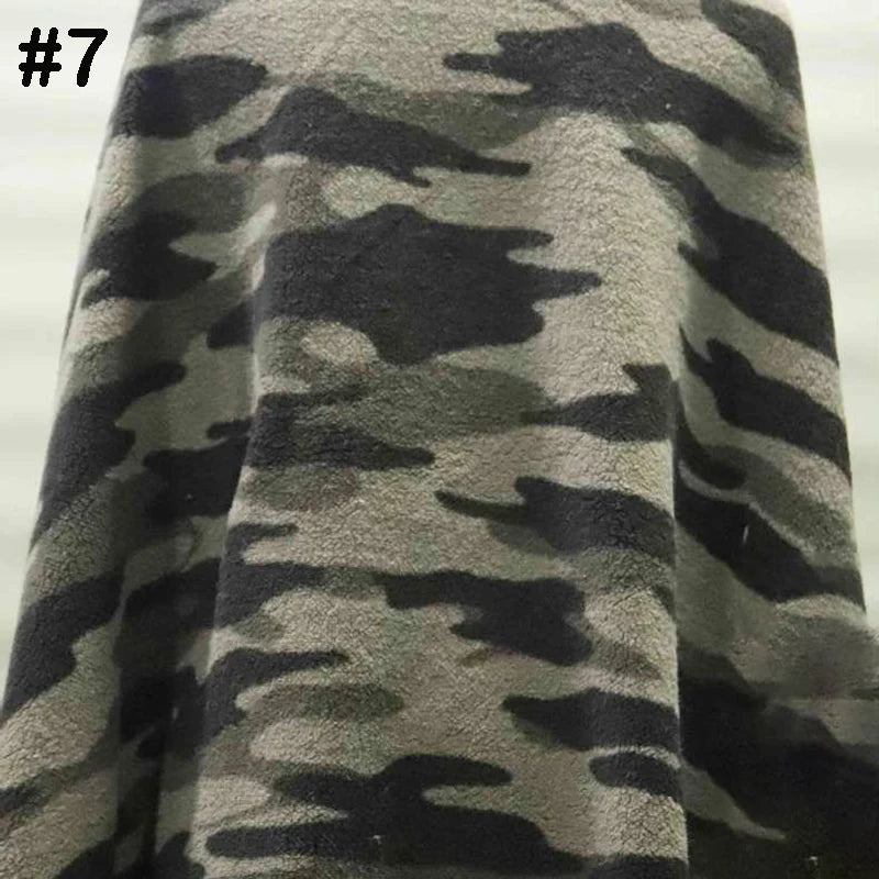 A close-up of Longon Craft's Printed Polar Fleece Fabric By The Yard, featuring a polyester ethnic leopard pattern. The top left corner displays a black number 7. Ideal for DIY craft and sewing projects.