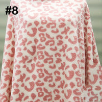 Longon Craft Printed Polar Fleece Fabric By The Yard in a pink and white leopard print is shown draped, marked with the number 8. Perfect for DIY crafts and sewing projects with soft, ethnic patterned polyester material.