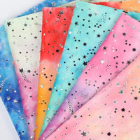 Six pieces of Longon Craft Rainbow Minky Fabric, a colorful tie-dye star-patterned cuddle material, are arranged in a fan shape. Perfect by the yard for plushies, craft, and sewing projects.