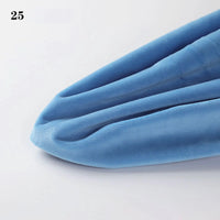 A close-up of Longon Craft’s Soft Minky Fabric By The Yard (1mm Cuddle Doll Plush), light blue with three seams, slightly pointed at one end, and labeled “25” in the top left corner.