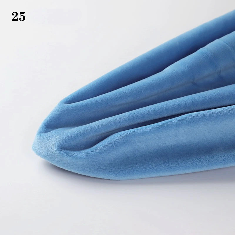 A close-up of Longon Craft’s Soft Minky Fabric By The Yard (1mm Cuddle Doll Plush), light blue with three seams, slightly pointed at one end, and labeled “25” in the top left corner.