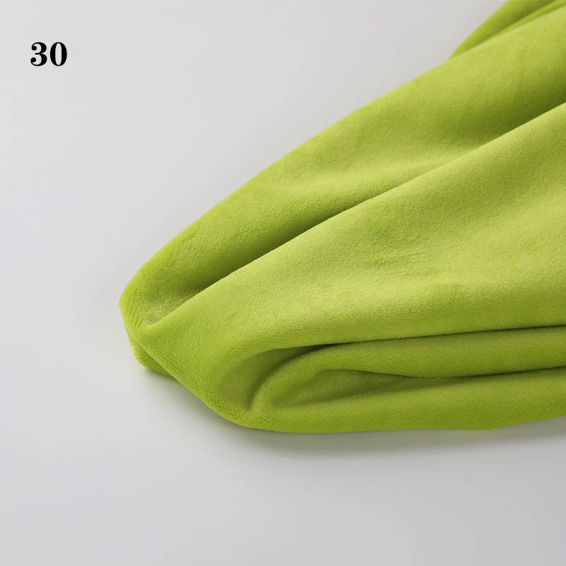 A close-up of lime green Longon Craft Soft Minky Fabric (1mm pile), perfect for plushies, DIY sewing, and upholstery. It's draped on a white surface with the number 30 in the top left corner.