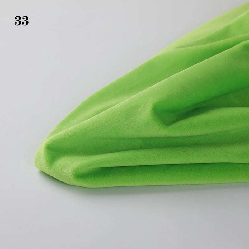A piece of bright green Longon Craft Soft Minky Fabric By The Yard (1mm Minky Cuddle Doll Plushies Material) is displayed on a white surface, with the number 33 in the top left corner.
