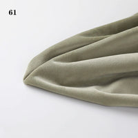 A close-up of Longon Craft Soft Minky Fabric By The Yard in light olive green, folded to show its 1mm plush texture for DIY sewing or upholstery, on a white background. "61" appears at the top left.