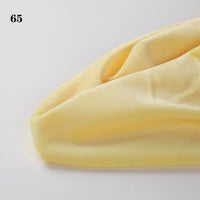 A close-up of Soft Minky Fabric By The Yard from Longon Craft in yellow, featuring gentle folds, plush 1mm doll plushies material, with the number 65 in the top left corner.