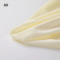 Longon Craft's Soft Minky Fabric By The Yard (1mm) with a smooth, light yellow texture is displayed on a white surface. Ideal for DIY sewing and plushies, it features the number 69 in the top left corner.