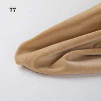 A close-up of Longon Craft’s light brown Soft Minky Fabric By The Yard, 1mm Minky Cuddle Doll Plushies Material, draped on a white surface with "77" in black at the top left. Perfect for DIY sewing and upholstery projects.