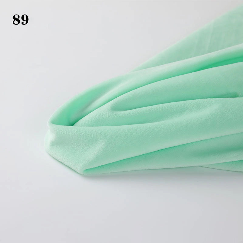 Soft mint green Longon Craft Soft Minky Fabric By The Yard (1mm Minky Cuddle Doll Plushies Material) draped on a white surface, with the number 89 in black text in the upper left corner.