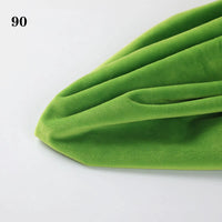 Close-up of Soft Minky Fabric By The Yard by Longon Craft in bright green, featuring a gentle 1mm texture—perfect for DIY sewing, crafts, plushies, and upholstery. The number 90 appears in the top left corner on a white background.