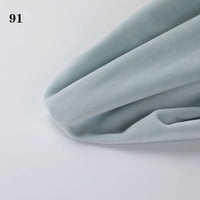 A close-up of light blue Longon Craft Soft Minky Fabric (1mm), perfect for DIY sewing, plushies, and upholstery, folded on a white surface with the number 91 in the top left corner.