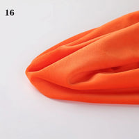 A piece of Soft Minky Fabric by the yard from Longon Craft is displayed on a white surface, bright orange in color, with "16" shown in black at the upper left. Ideal for DIY sewing and plushies.