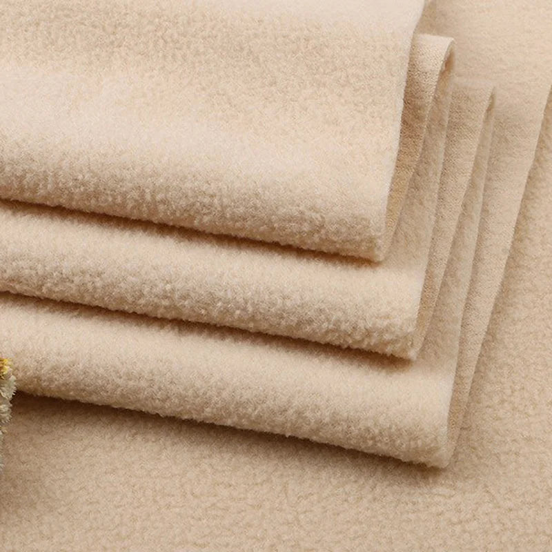 Close-up of several folded pieces of Longon Craft Solid Polar Fleece Fabric By The Yard, showcasing its thick, plush 100% polyester texture—perfect for blankets, DIY sewing, crafts, and upholstery projects.