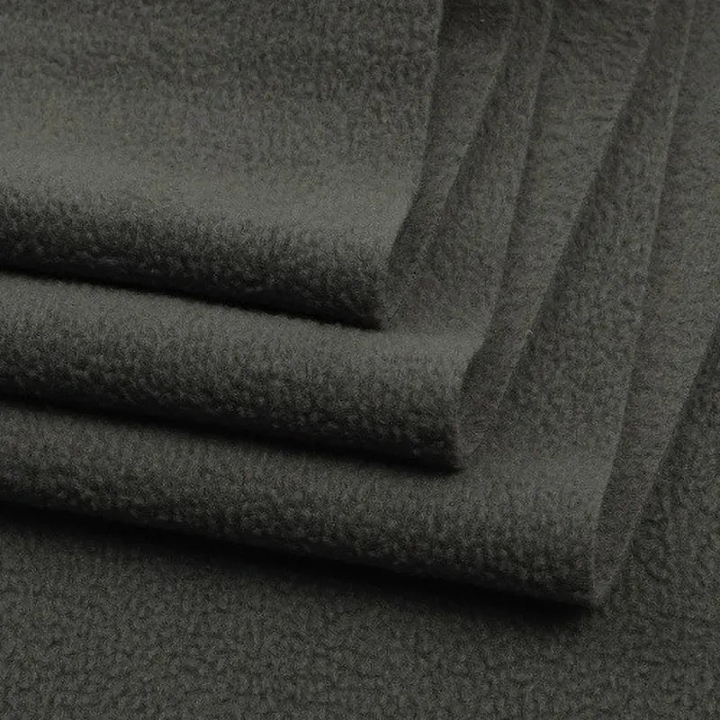 Close-up of several layers of Longon Craft Solid Polar Fleece Fabric by the yard—thick 100% polyester with a soft, textured, and fluffy surface, ideal for cozy blankets, DIY sewing, crafts, and upholstery.