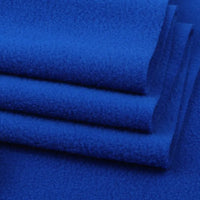 Close-up of folded royal blue Solid Polar Fleece Fabric by Longon Craft—thick, soft 100% polyester material perfect for cozy blankets, DIY sewing, craft projects, and upholstery. Sold by the yard for versatile use.