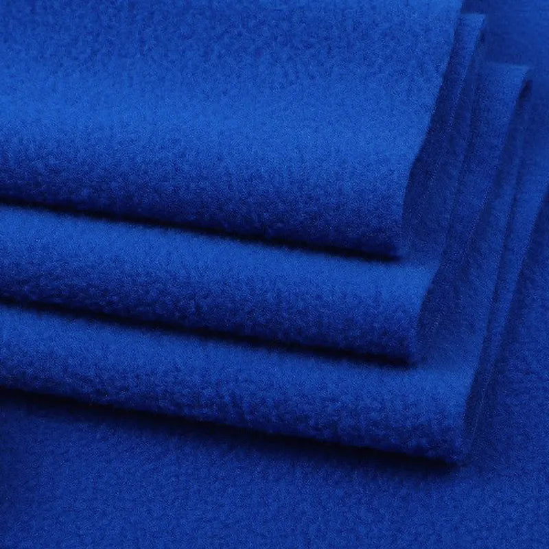 Close-up of folded royal blue Solid Polar Fleece Fabric by Longon Craft—thick, soft 100% polyester material perfect for cozy blankets, DIY sewing, craft projects, and upholstery. Sold by the yard for versatile use.