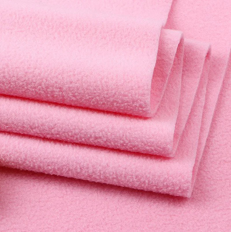 Longon Craft Solid Polar Fleece Fabric By The Yard—thick, soft, light pink 100% polyester—showcases plush texture and warmth, perfect for cozy DIY blankets, crafts, or upholstery projects.