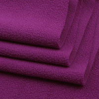 Close-up of three folded pieces of Longon Craft Solid Polar Fleece Fabric By The Yard in deep purple, highlighting the thick, soft 100% polyester surface—ideal for cozy blankets, upholstery, or DIY sewing projects.