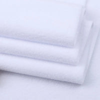 Several pieces of Longon Craft Solid Polar Fleece Fabric By The Yard display their plush, smooth texture—ideal thick 100% polyester fabric for cozy DIY sewing, crafts, or upholstery projects.