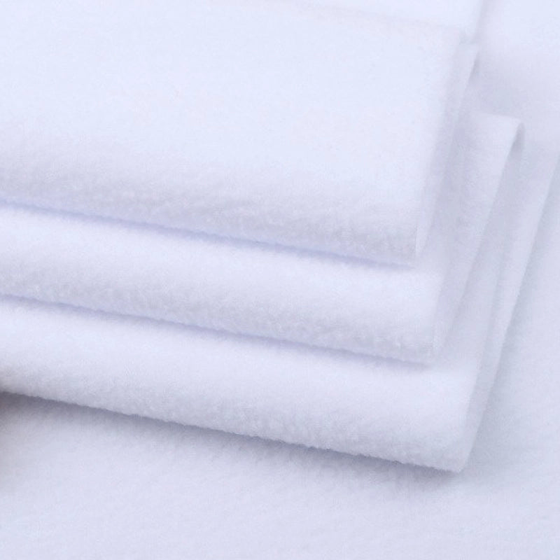 Several pieces of Longon Craft Solid Polar Fleece Fabric By The Yard display their plush, smooth texture—ideal thick 100% polyester fabric for cozy DIY sewing, crafts, or upholstery projects.