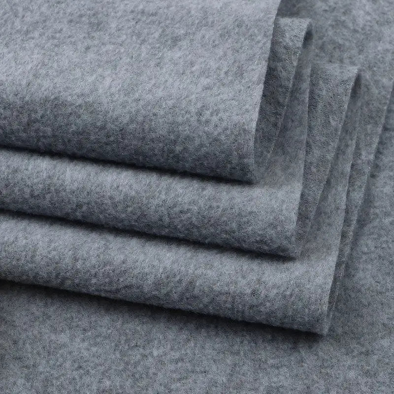 Four neatly folded pieces of Longon Craft’s Solid Polar Fleece Fabric—thick, soft, gray 100% polyester—stacked to showcase clean edges and cozy texture, ideal for DIY sewing, crafts, upholstery, or polar fleece blankets.