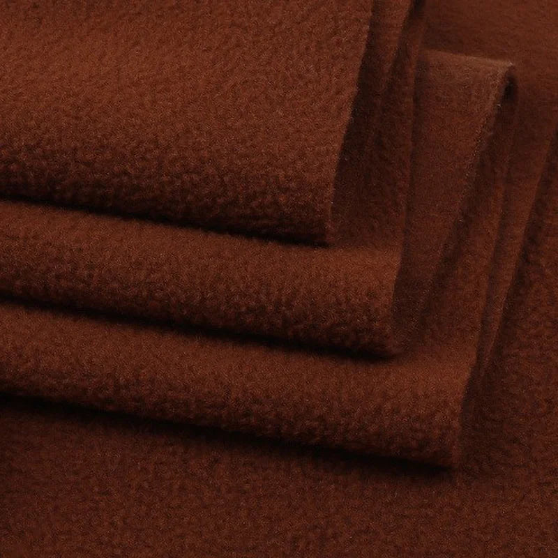 A close-up of folded Solid Polar Fleece Fabric by the yard from Longon Craft, a thick, plain 100% polyester fabric—ideal for cozy blankets, DIY sewing, crafts, or upholstery projects.