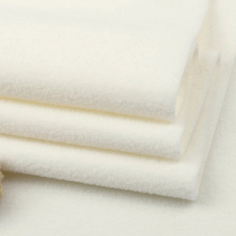 A close-up shows three neatly folded pieces of Longon Craft Solid Polar Fleece Fabric by the yard, a thick, plain 100% polyester material with a smooth, slightly fuzzy texture—ideal for DIY sewing and upholstery projects.