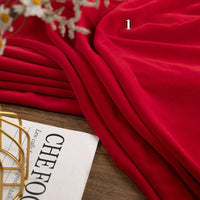 Longon Craft’s Stretch Minky Fabric by the Yard (Multicolor, Four-Way Stretch) is shown draped on wood near a magazine and gold wire basket, with a number 1 overlaying the fabric—ideal for DIY clothing, plushies, and crafts.