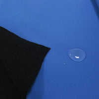 A water droplet sits on the Longon Craft Waterproof Polar Fleece Fabric, highlighting the 4-way stretch polyester’s water-resistant properties ideal for sewing and outdoor crafts.