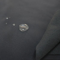 Close-up of Longon Craft Waterproof Polar Fleece Fabric By The Yard shows water droplets beading up, highlighting its water-repellent surface and soft inner texture. Ideal 4-way stretch polyester fabric for outdoor gear and crafts.